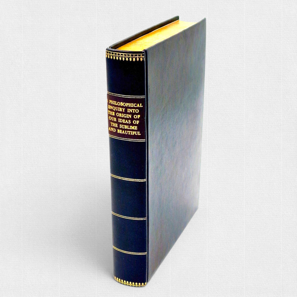 Elegant full leather binding of A Philosophical Enquiry into the Origin of Our Ideas of the Sublime and Beautiful by Edmund Burke, with gilt-lettered spine, decorative tooling, and gilt edges.