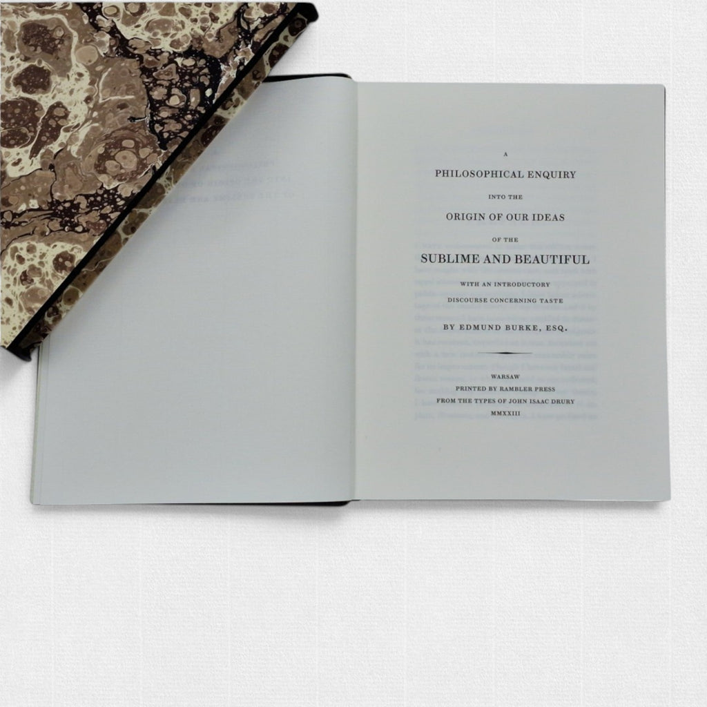 Opening title page of A Philosophical Enquiry into the Origin of Our Ideas of the Sublime and Beautiful by Edmund Burke, with elegant typography and hand-marbled boards.
