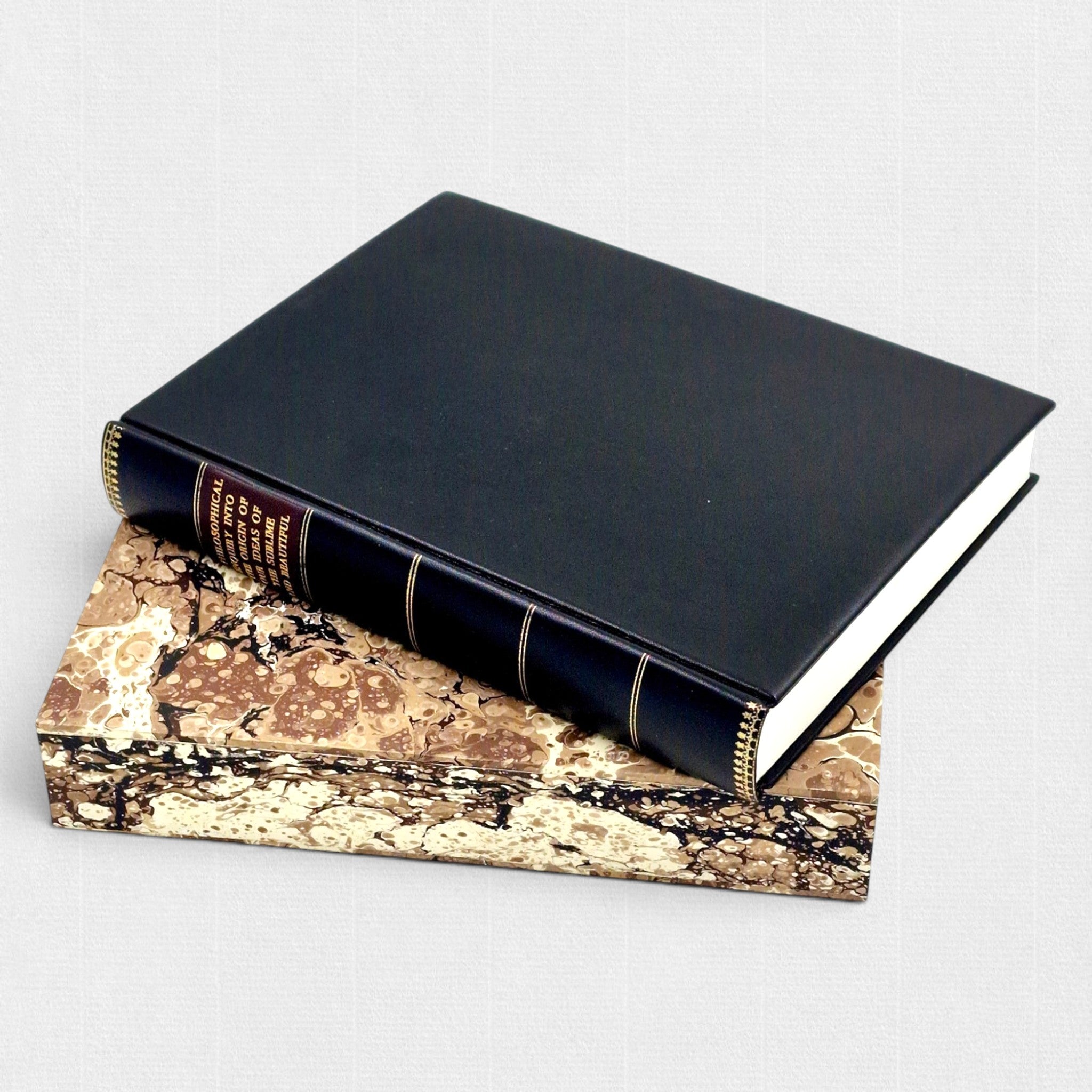 Limited edition Woodbank Press fine press book of Edmund Burke's A Philosophical Inquiry into the Origin of Our Ideas of the Sublime and Beautiful, hand-bound in leather with gilt-decorated spine and presented on a hand-marbled slipcase.
