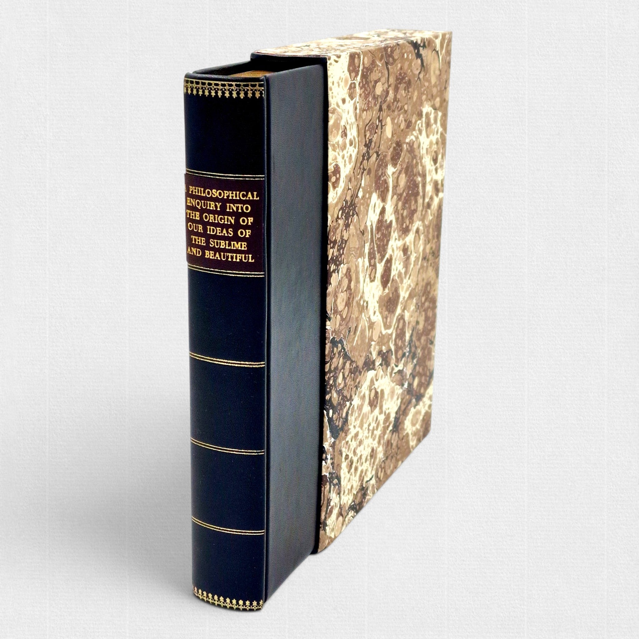 Limited edition Woodbank Press fine press book of Edmund Burke's A Philosophical Inquiry into the Origin of Our Ideas of the Sublime and Beautiful, showing the leather binding, gilt spine and hand-marbled slipcase.