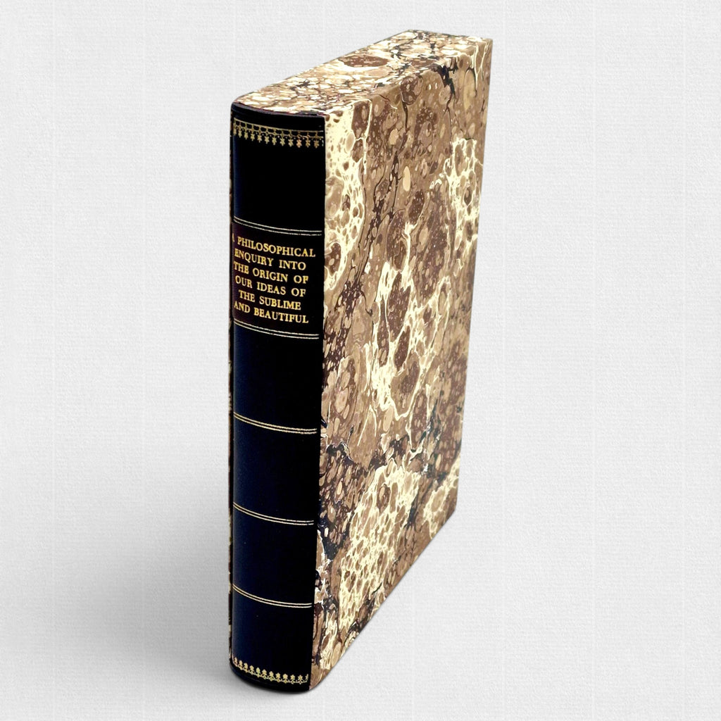 Woodbank Press fine press edition of Edmund Burke's A Philosophical Inquiry into the Origin of Our Ideas of the Sublime and Beautiful, showing the gilt-decorated leather spine and hand-marbled slipcase.