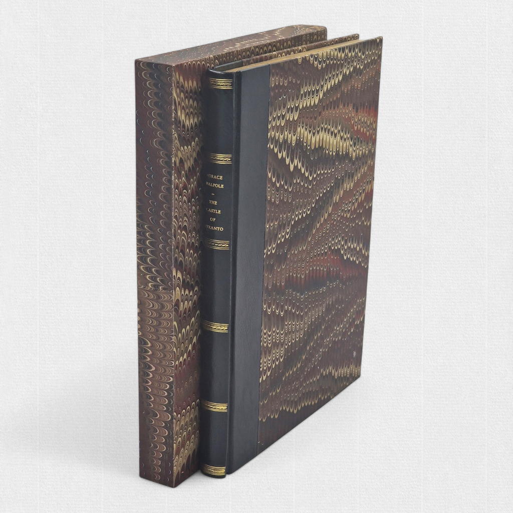 The Castle of Otranto fine press edition with custom slipcase, showing half-leather binding, marbled paper sides, and gilt spine lettering.