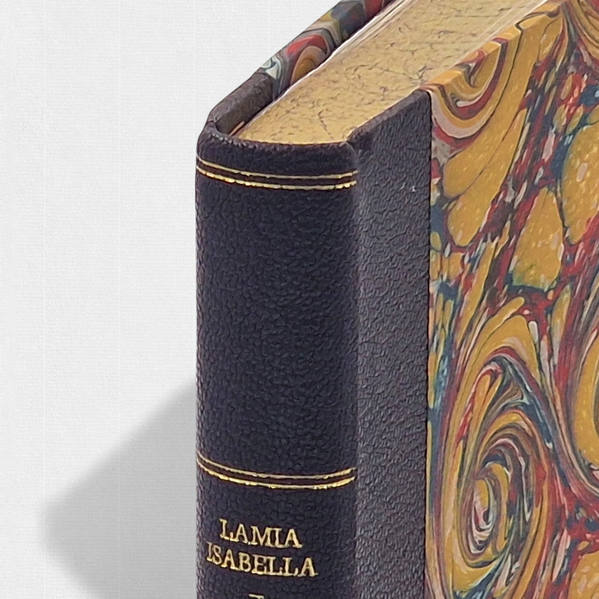 Close-up of the leather spine of John Keats Selected Poems showing gilt tooling and hand-bound craftsmanship
