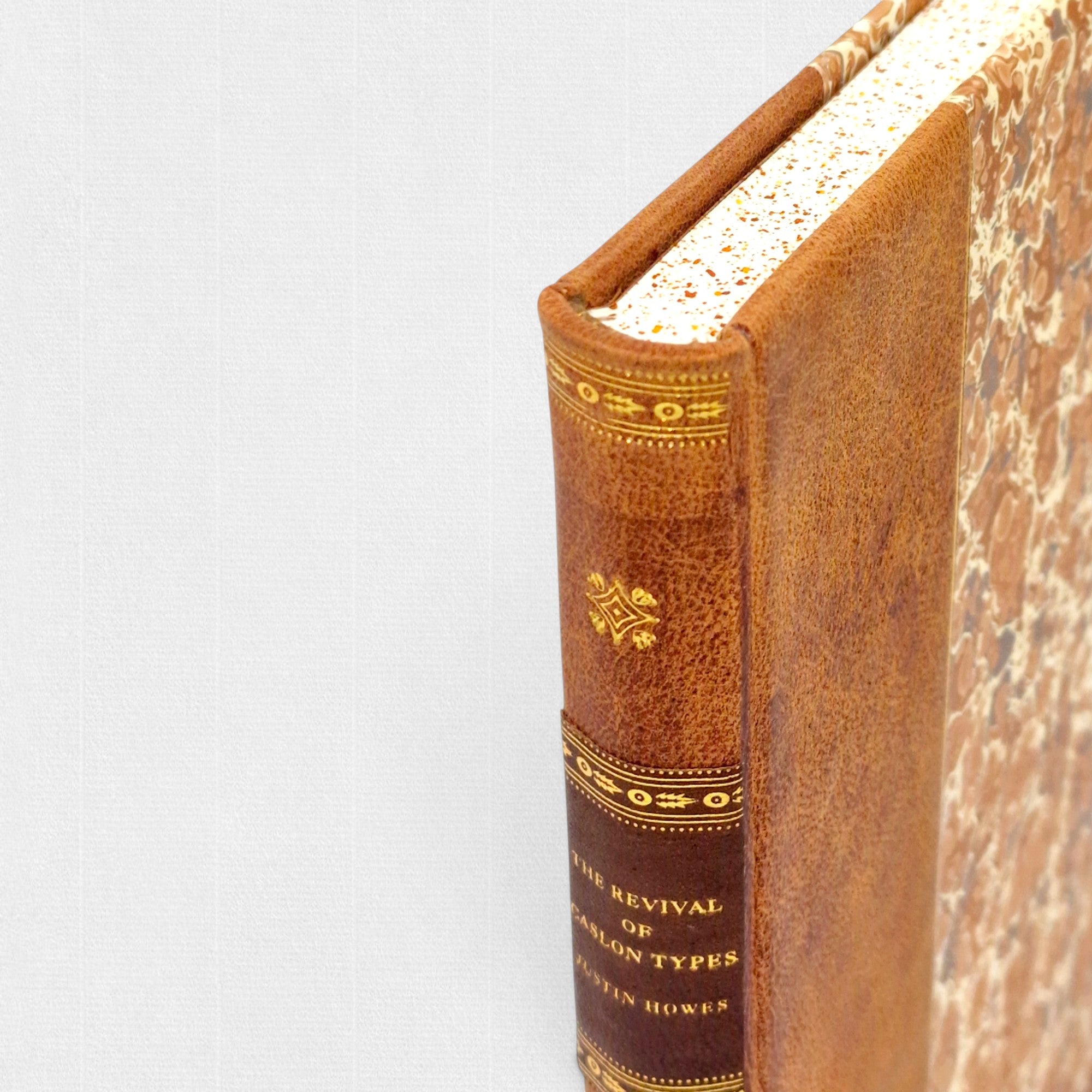 Interior specimen spread of The Revival of Caslon Types, showing Caslon typeforms printed on Fabriano Tiepolo pure cotton paper.