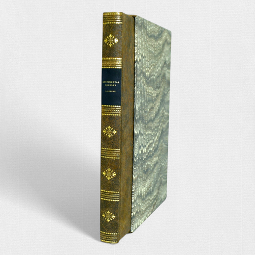 Woodbank Press edition of A Sentimental Journey Through France and Italy by Laurence Sterne, showing hand-bound half-leather binding with gilt spine decoration and marbled boards.