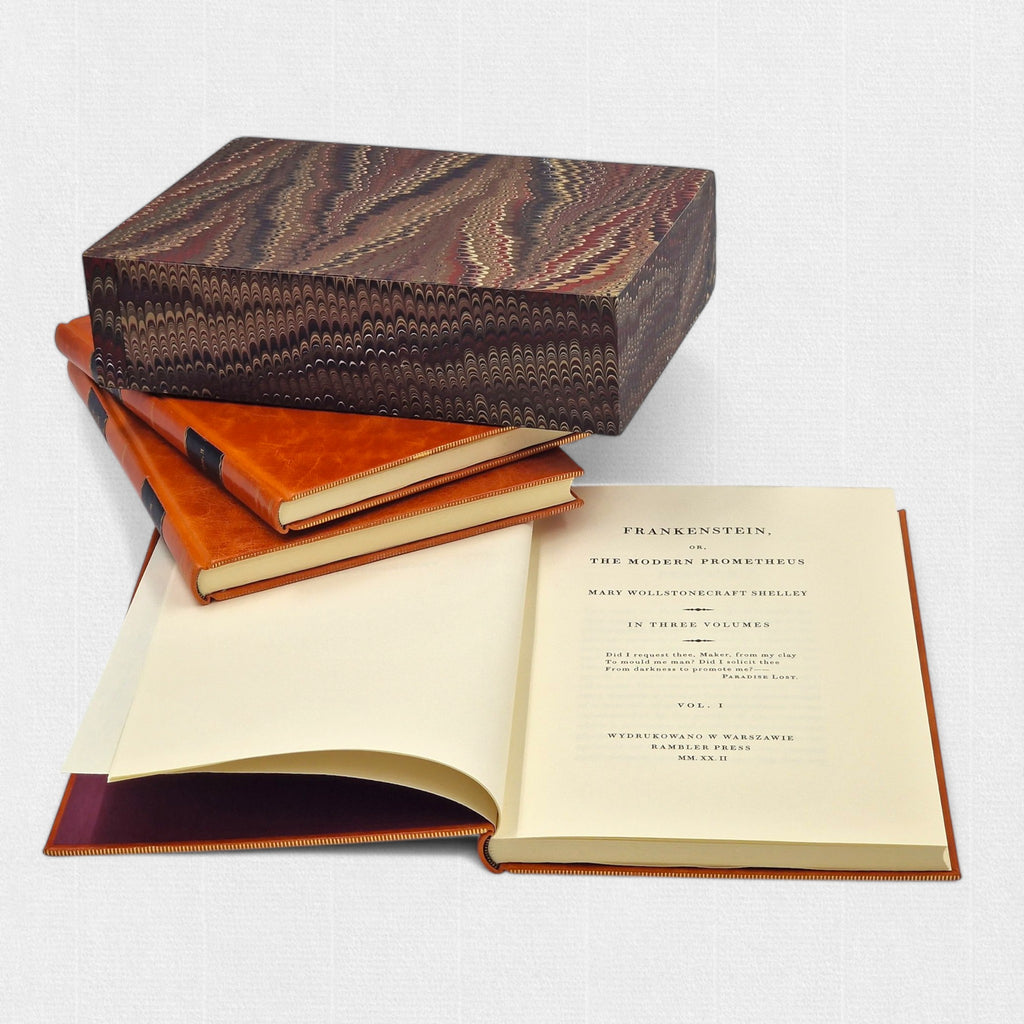 Open volumes of Mary Shelley’s Frankenstein displayed with marbled slipcase.