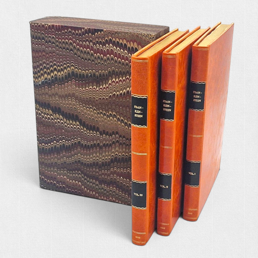 Fine press three-volume edition of Frankenstein by Mary Shelley, hand-bound in full leather and presented with a marbled slipcase by Woodbank Press.