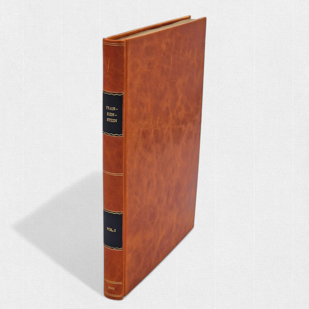 Volume I of Frankenstein in full leather binding with gilt spine decoration.