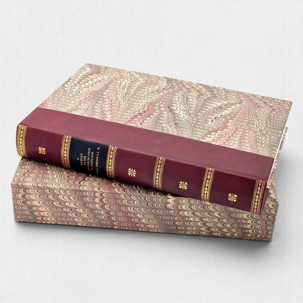 Samuel Johnson A Journey to the Western Islands of Scotland by Woodbank Press, showing the hand-bound leather spine with gilt tooling, marbled boards, and matching marbled slipcase in a limited edition of 25 copies.