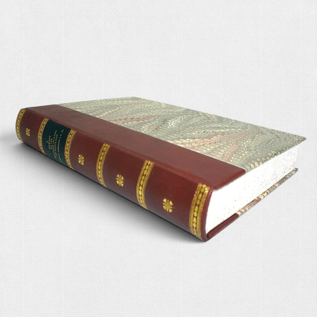 Samuel Johnson A Journey to the Western Islands of Scotland fine press edition by Woodbank Press, showing the hand-bound leather binding, gilt-decorated spine, marbled boards, and traditional private press craftsmanship.