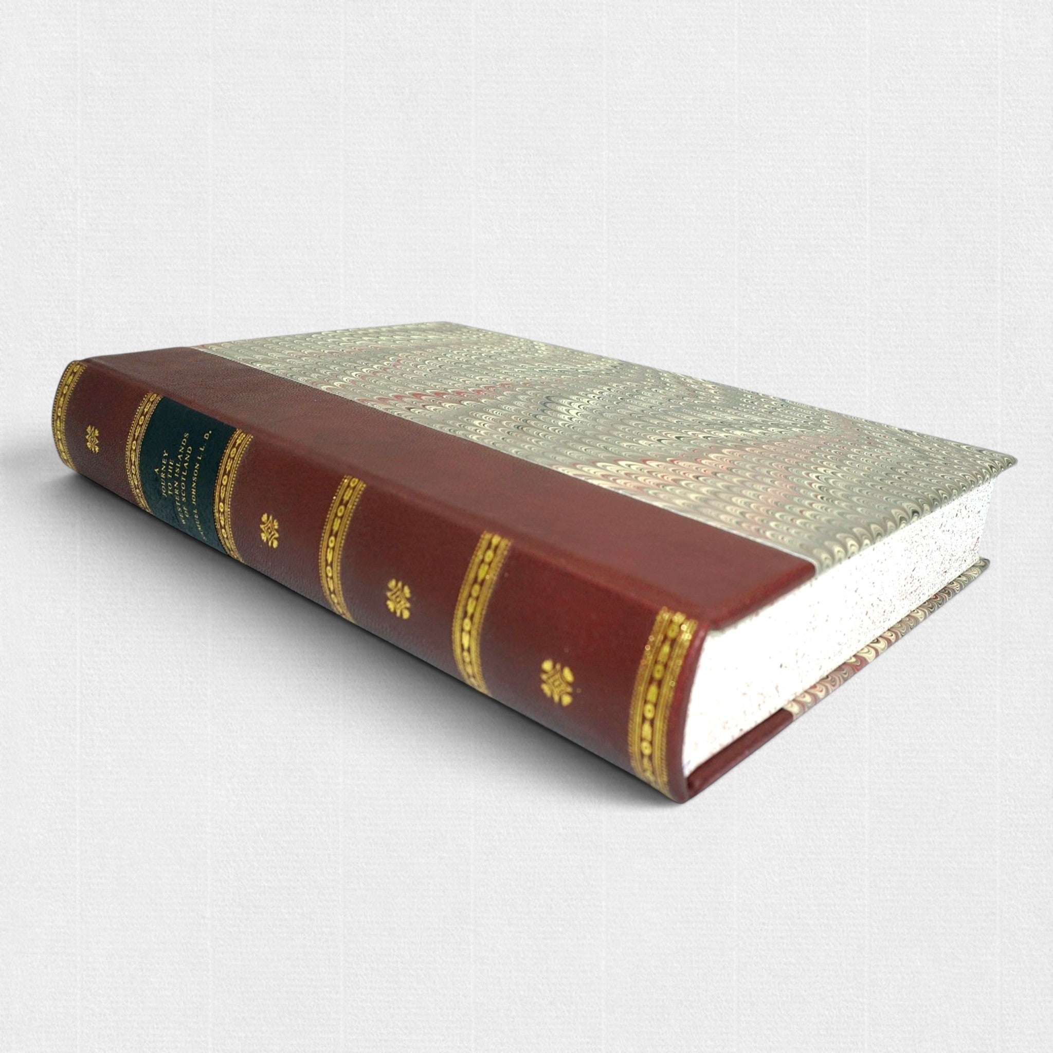 Samuel Johnson A Journey to the Western Islands of Scotland fine press edition by Woodbank Press, showing the hand-bound leather binding, gilt-decorated spine, marbled boards, and traditional private press craftsmanship.