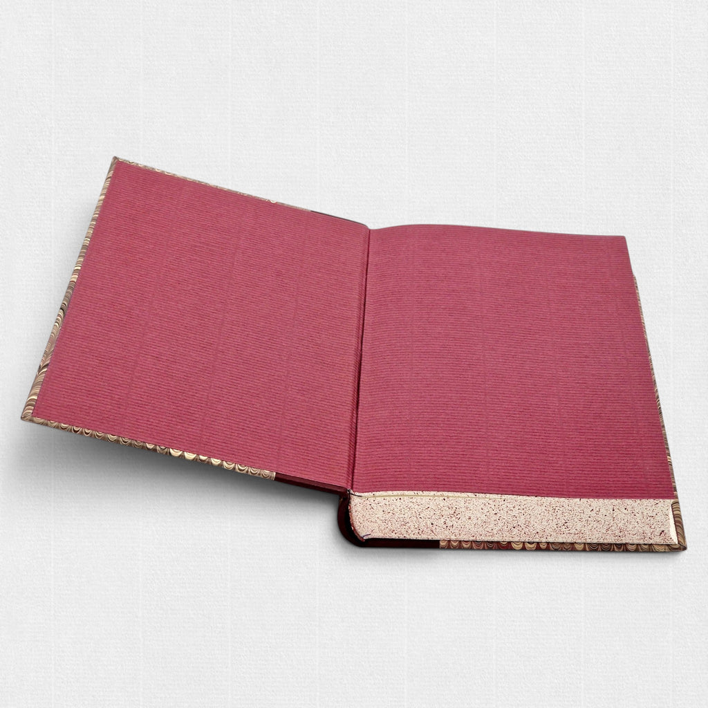 Samuel Johnson A Journey to the Western Islands of Scotland fine press edition by Woodbank Press, showing marbled endpapers, speckled page edges, and traditional hand bookbinding details.