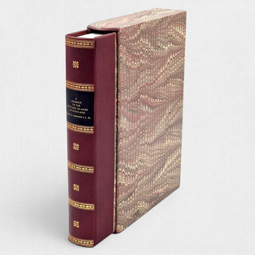 Samuel Johnson A Journey to the Western Islands of Scotland fine press edition by Woodbank Press, burgundy leather binding with gilt-decorated spine, marbled slipcase, and traditional hand bookbinding in a limited edition of 25 copies.