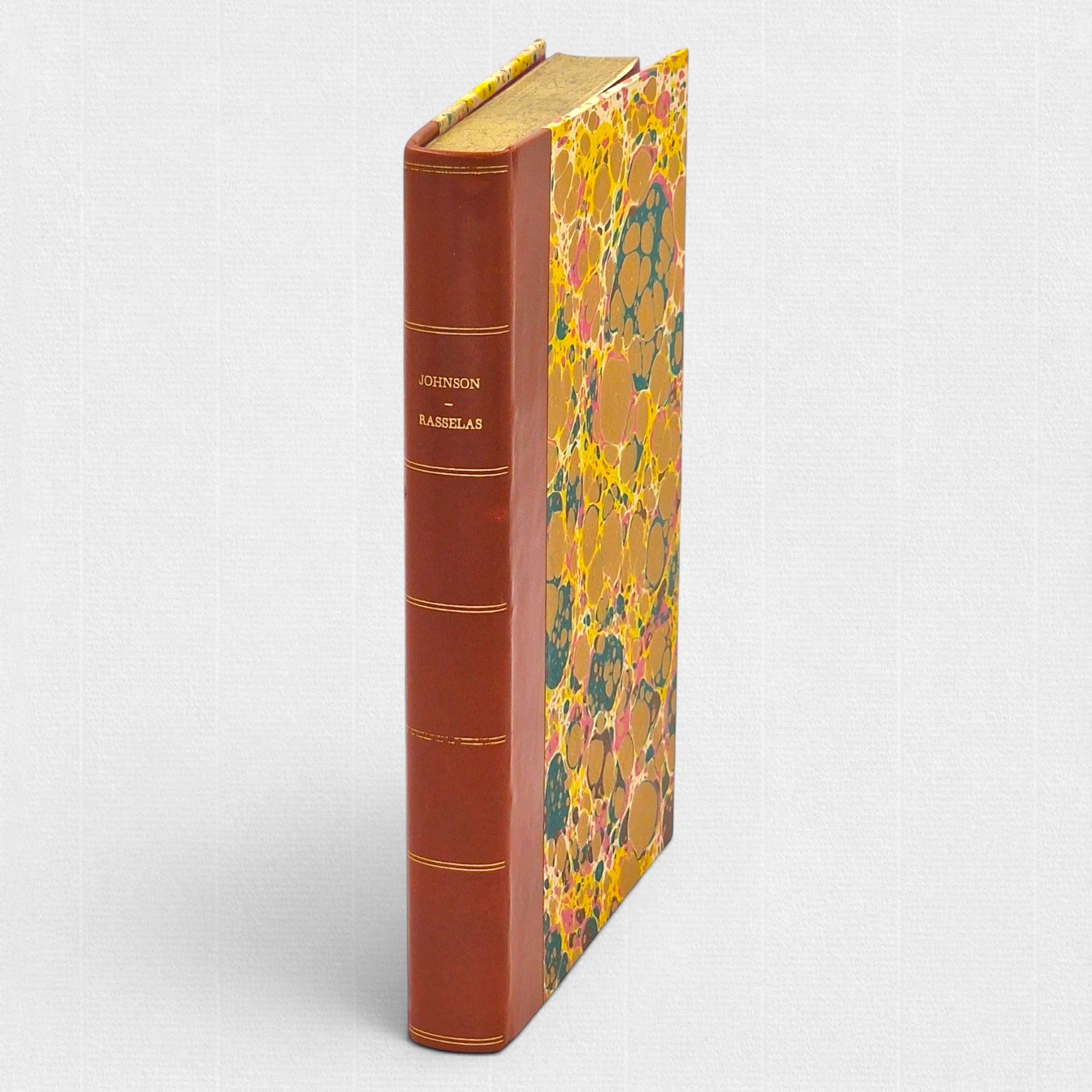 Rasselas by Samuel Johnson, fine press collector's edition by Woodbank Press, hand-bound in half leather with marbled paper boards, gilt spine and Conqueror Laid paper.