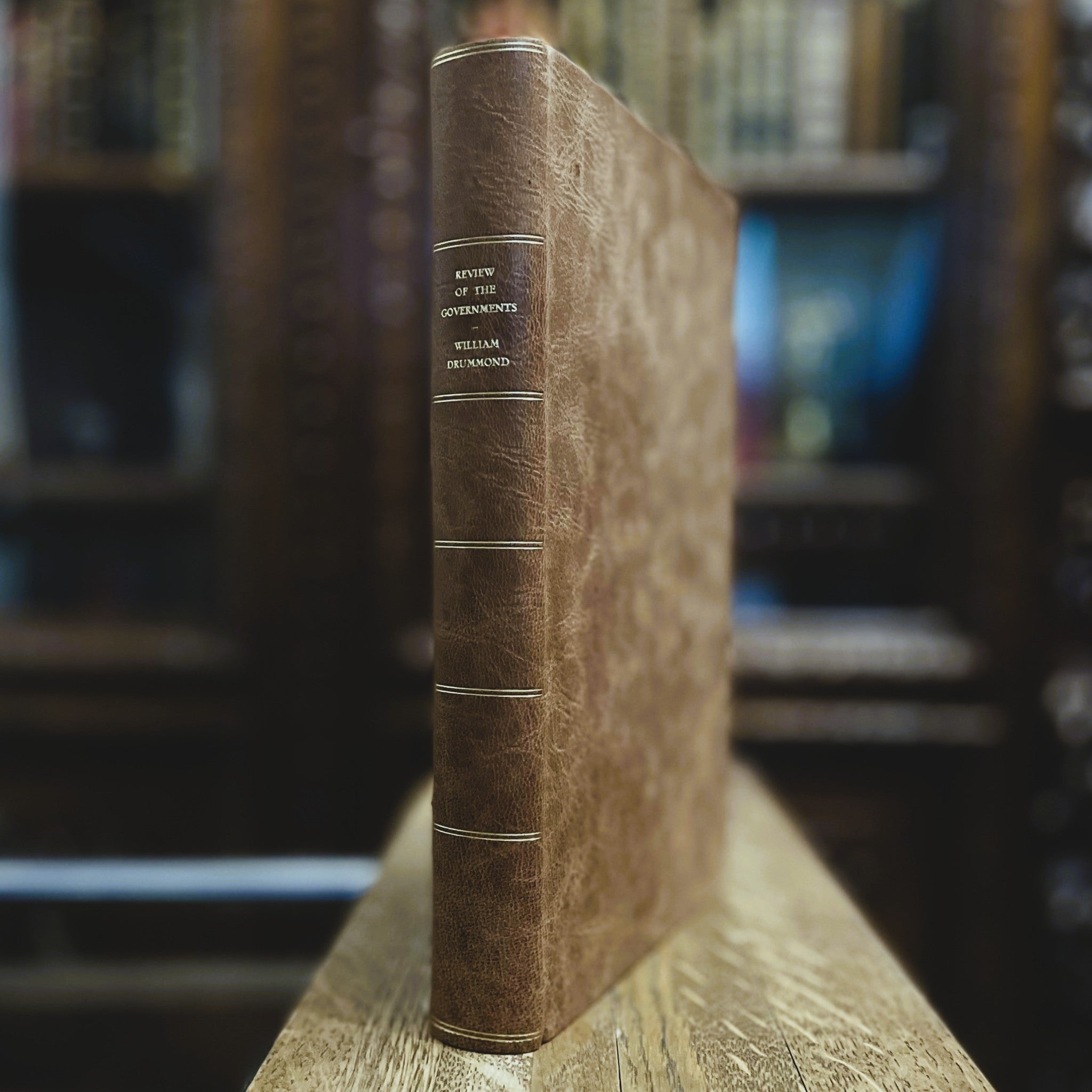 A Review of the Governments of Sparta and Athens by Sir William Drummond, hand-bound fine press edition by Woodbank Press in full leather binding, displayed in a private library.