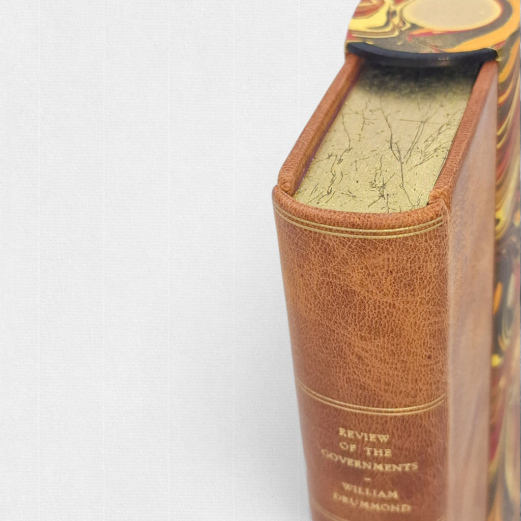 Gilt top edge, full leather binding and spine detail of A Review of the Governments of Sparta and Athens by Sir William Drummond, hand-bound fine press edition by Woodbank Press.