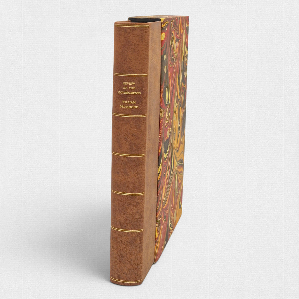 Spine view of A Review of the Governments of Sparta and Athens by Sir William Drummond, limited fine press edition by Woodbank Press, hand-bound in full leather with gilt-lettered spine and marbled slipcase.