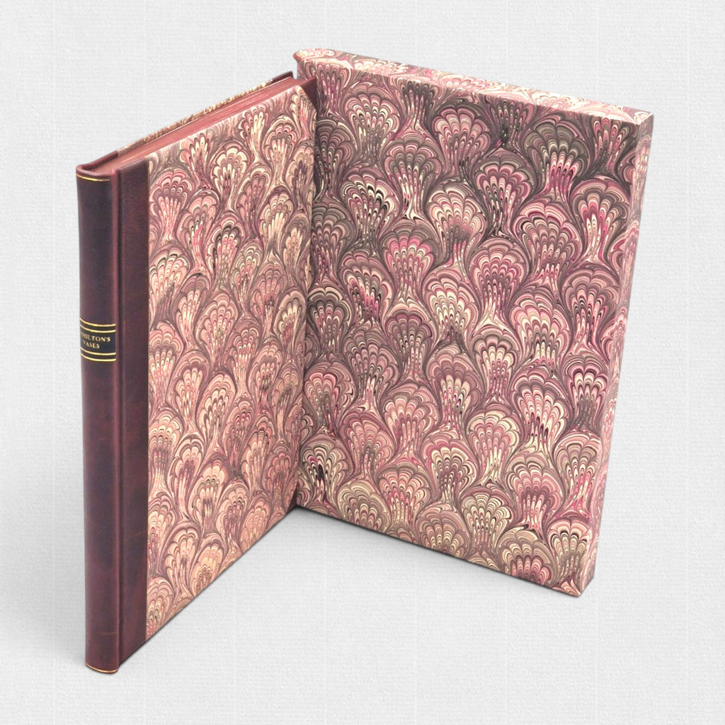 Open marbled slipcase with leather-bound Hamilton’s Vases, handcrafted by Woodbank Press.
